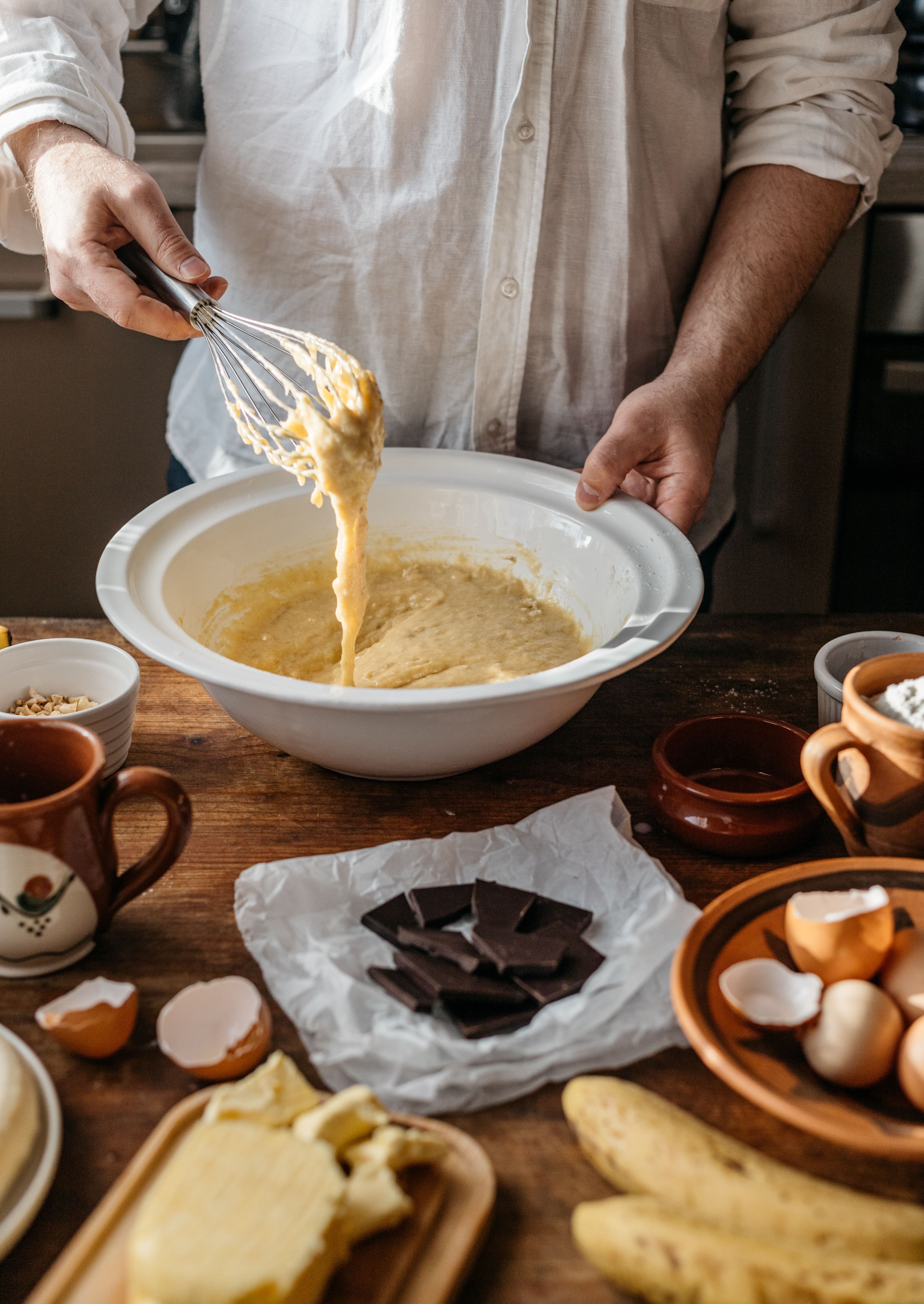 man-baking-banana-bread-at-home-on-a-sunny-day-2023-11-27-04-50-44-utc.jpg